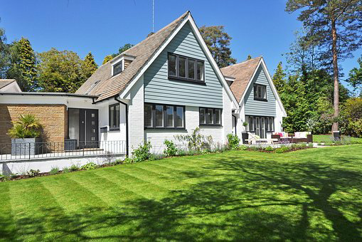 Large house with well kept lawns.