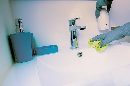 Bathroom being cleaned.